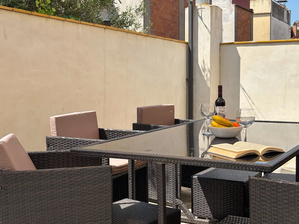 Exterior terrace of Ca La Fustereta Figueres with street views and relaxation area